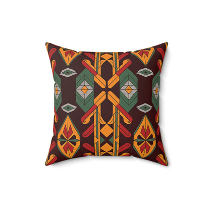 Square faux suede pillow with a geometric, tribal-inspired pattern in red, gold, orange, green, and black. The symmetrical design features diamond shapes and teardrop motifs—an ideal African accent pillow for any modern space.