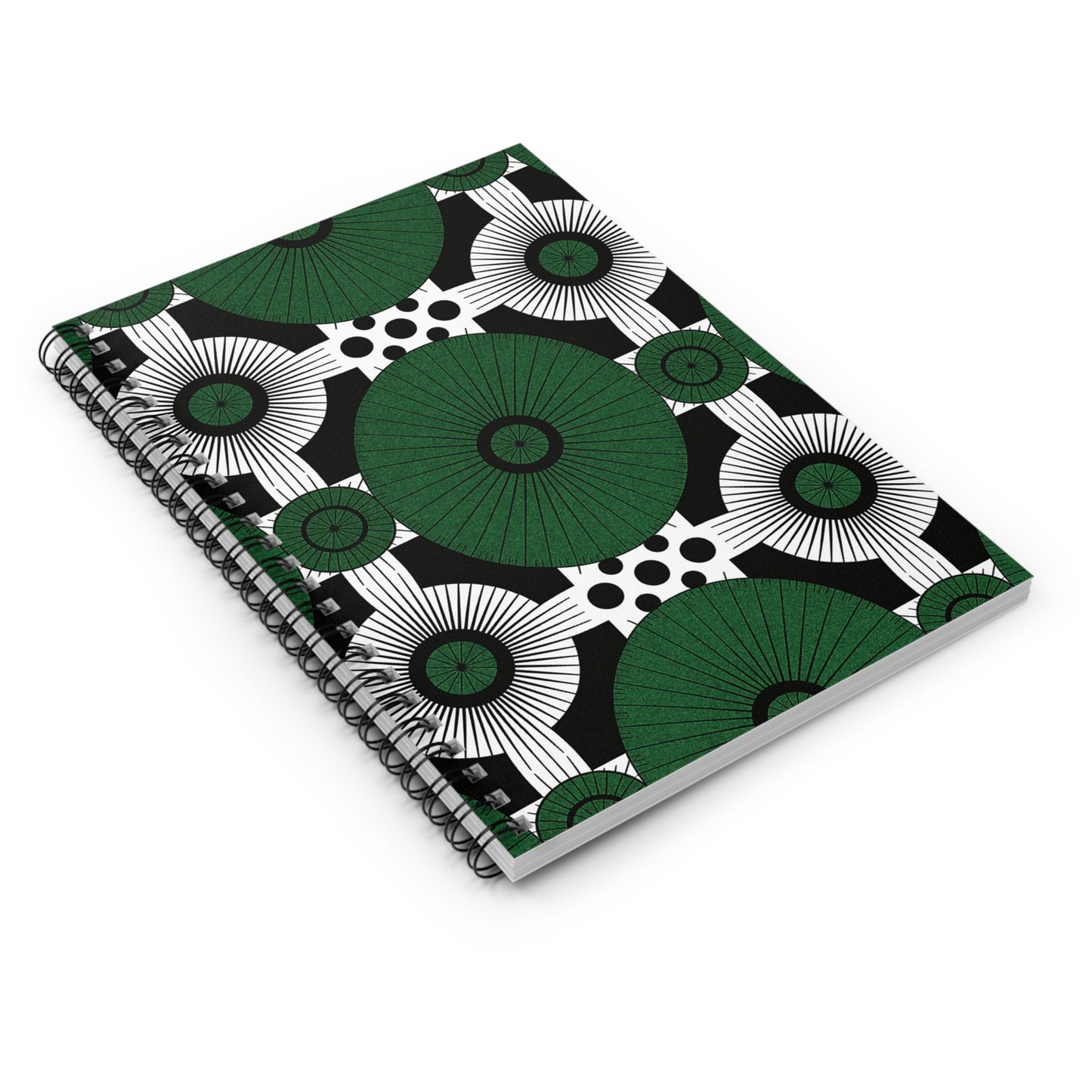 An African-inspired spiral notebook with a cover design of large green circles, black and white accents, and polka dots on white. Positioned at an angle, it features a front cover and spiral binding for a premium writing experience.