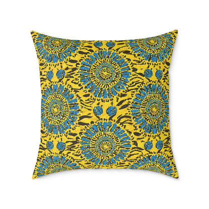 A vibrant throw pillow featuring a symmetrical pattern of blue and teal circular floral designs on a bright yellow background, accented with black animal print-inspired spots and lines. This colorful home decor piece has crisp edges and a smooth texture.