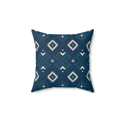Square pillow with a dark blue background and geometric diamond shapes in white and light blue, arranged symmetrically. This African-inspired pillow brings a modern, bohemian touch to unique home decor, making vibrant pillows the highlight of any space.