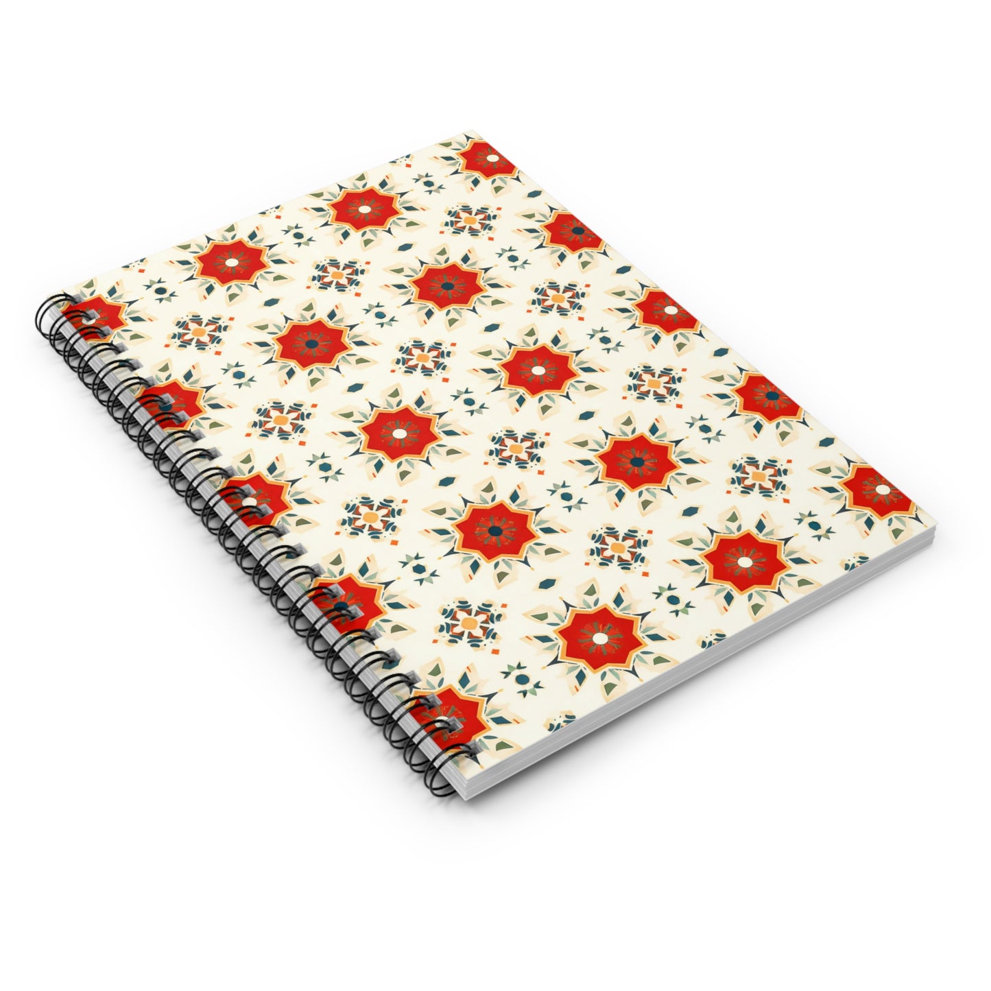 A spiral-bound notebook with a cream-colored cover, decorated with culturally inspired designs featuring red and orange geometric floral patterns and small green leaves. The notebook offers a premium writing experience and is placed at an angle on a white surface.