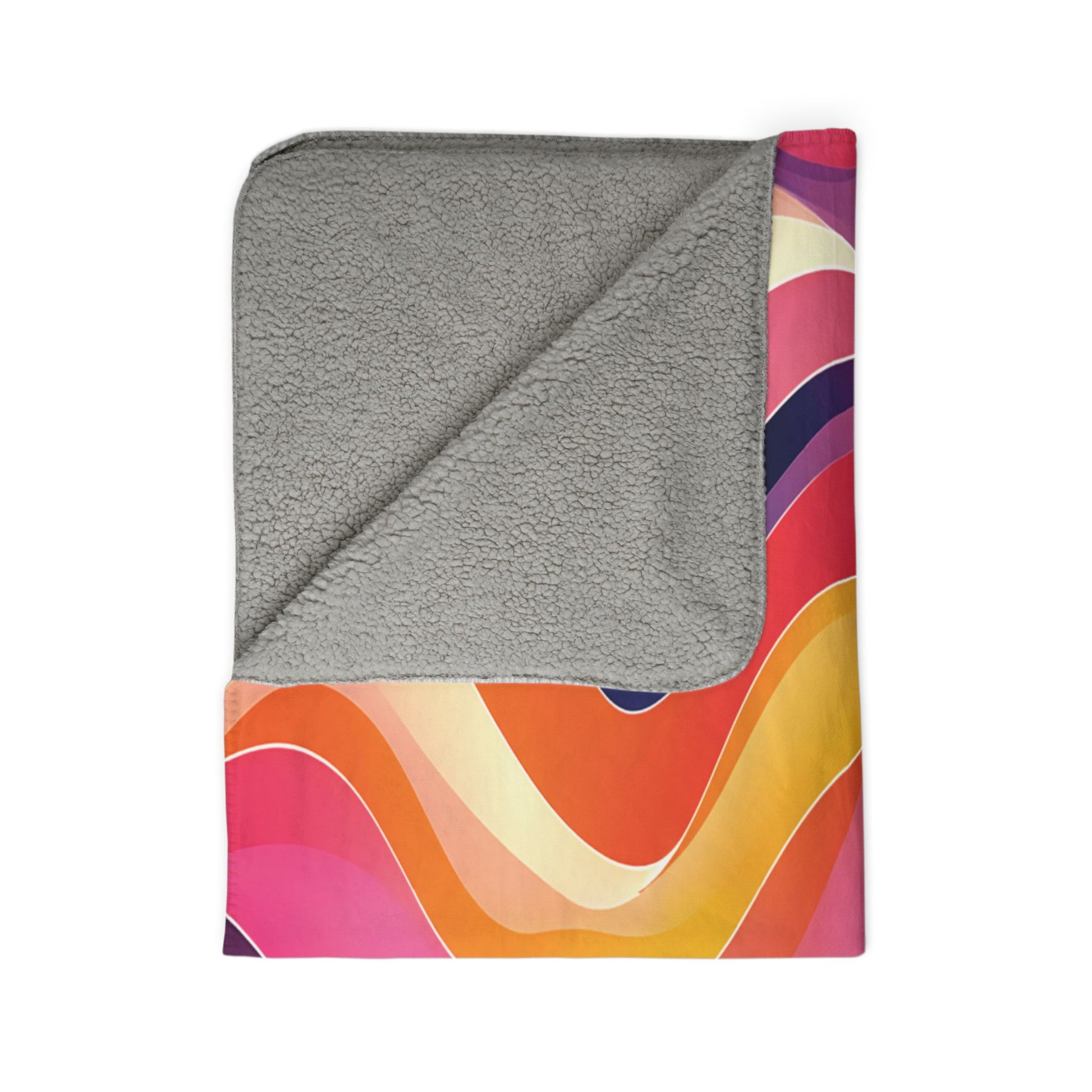 A sherpa fleece blanket with a plush, light gray side folded over, revealing a colorful retro wave pattern in orange, yellow, pink, red, and purple. This personalized blanket is displayed on a white background.
