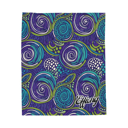 A brightly colored, African-inspired blanket features swirling spirals in purple, blue, and green with dotted accents. The dark purple background and the bold white “Efflong” script add a unique touch—perfect as a personalized velveteen blanket or custom gift.