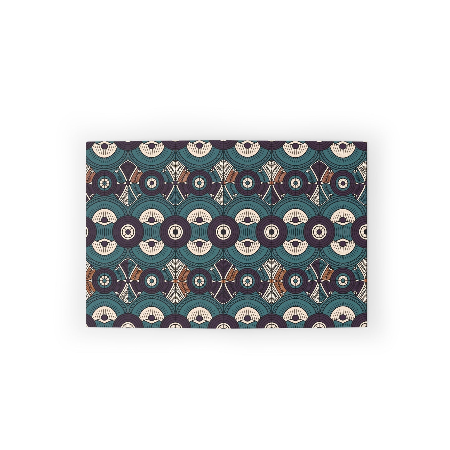 Rectangular mat featuring a culturally inspired design with repeating geometric patterns—circles, arcs, and star shapes in navy blue, cream, maroon, and brown. The symmetrical layout creates a visually striking, rhythmic look on a white background.