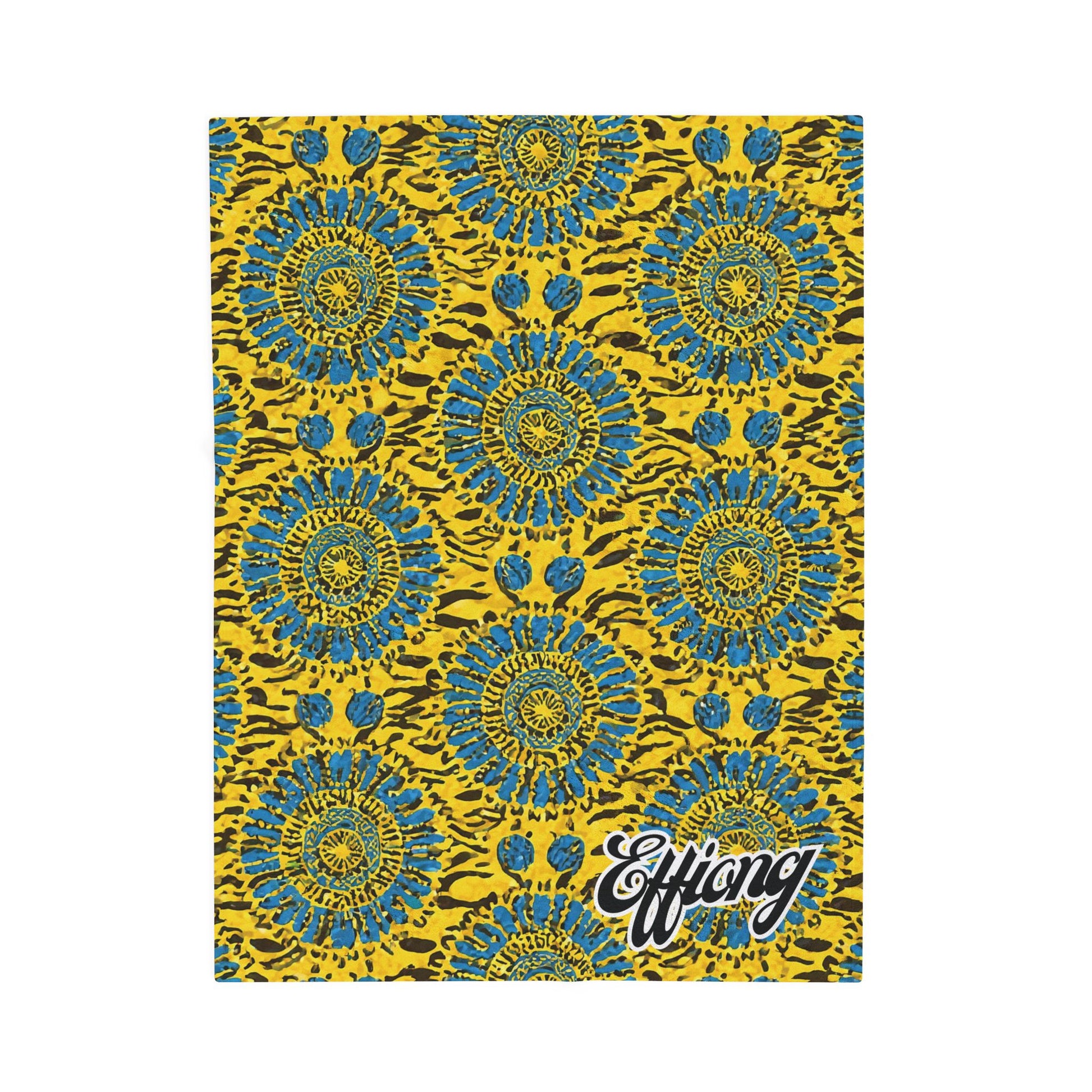 A vibrant pattern with blue and green circular floral shapes and dots repeats on a bright yellow background with black irregular spots. Effiong appears in bold, cursive white letters—a striking African-inspired personalized blanket and unique gift keepsake.