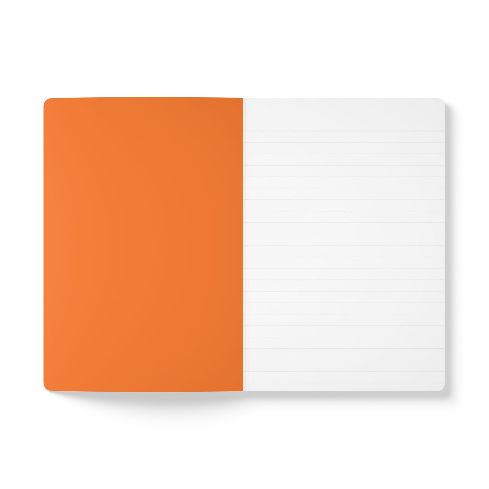 An open creative journal lies flat, showing two pages. The left page is entirely orange and blank, while the right is white with light lines, ready for writing. Both pages have rounded top corners, and the notebook is photographed on a white background.