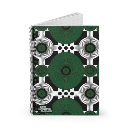 A spiral-bound notebook with a bold, African-inspired geometric pattern of green circles, black and white concentric shapes, and black dots on white. The bottom left reads “The Content Shop” in white, celebrating culturally inspired designs.