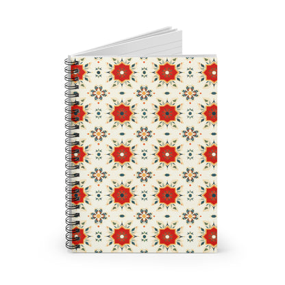 A culturally inspired notebook, this spiral-bound journal features a repeating pattern of red and orange star-shaped floral motifs with green and blue accents on an off-white cover. Slightly open, it reveals lined pages for your notes or sketches.
