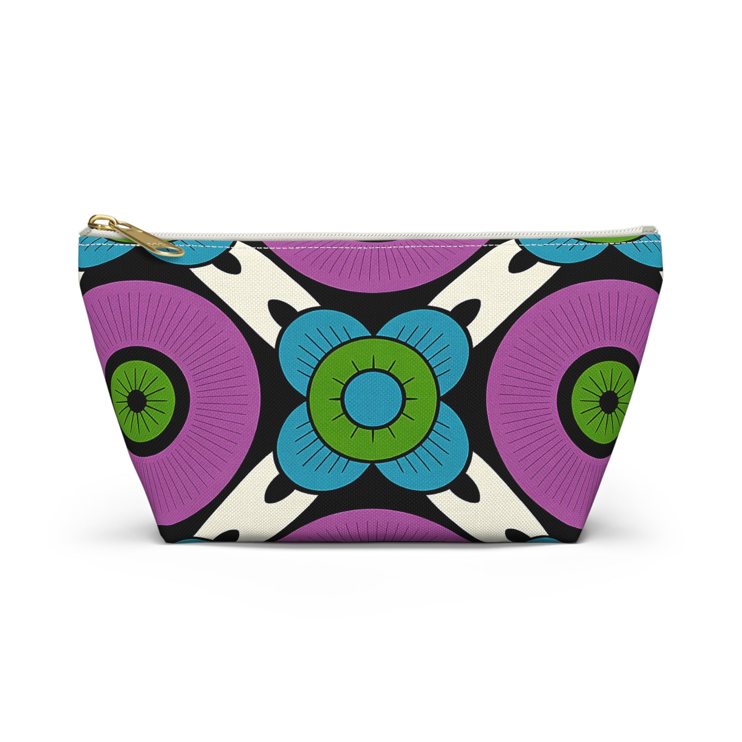 A zippered T-bottom pouch with a bold geometric floral pattern, reminiscent of African-inspired patterns. Large purple circles, green and blue stylized flowers, and black-and-white abstract shapes pop on a cream background. Gold-colored zipper.
