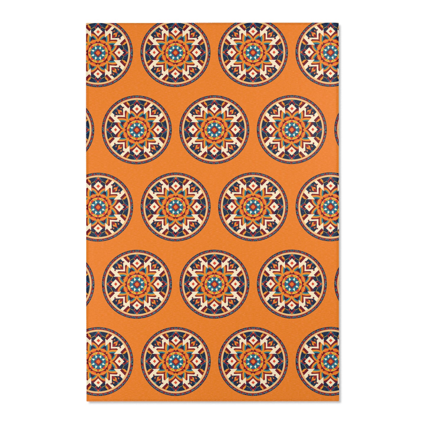 A rectangular mat with an orange background featuring a repeating pattern of African-inspired, mandala-like designs in blue, red, white, and black. The circles are evenly spaced in a grid layout, creating a vibrant geometric look.