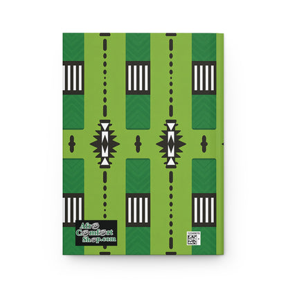 A hardcover African inspired notebook with a bold geometric pattern in black, white, and dark green. The AfroComiArtShop.com logo appears in the lower left corner, with a QR code nearby on the right. The background is white.