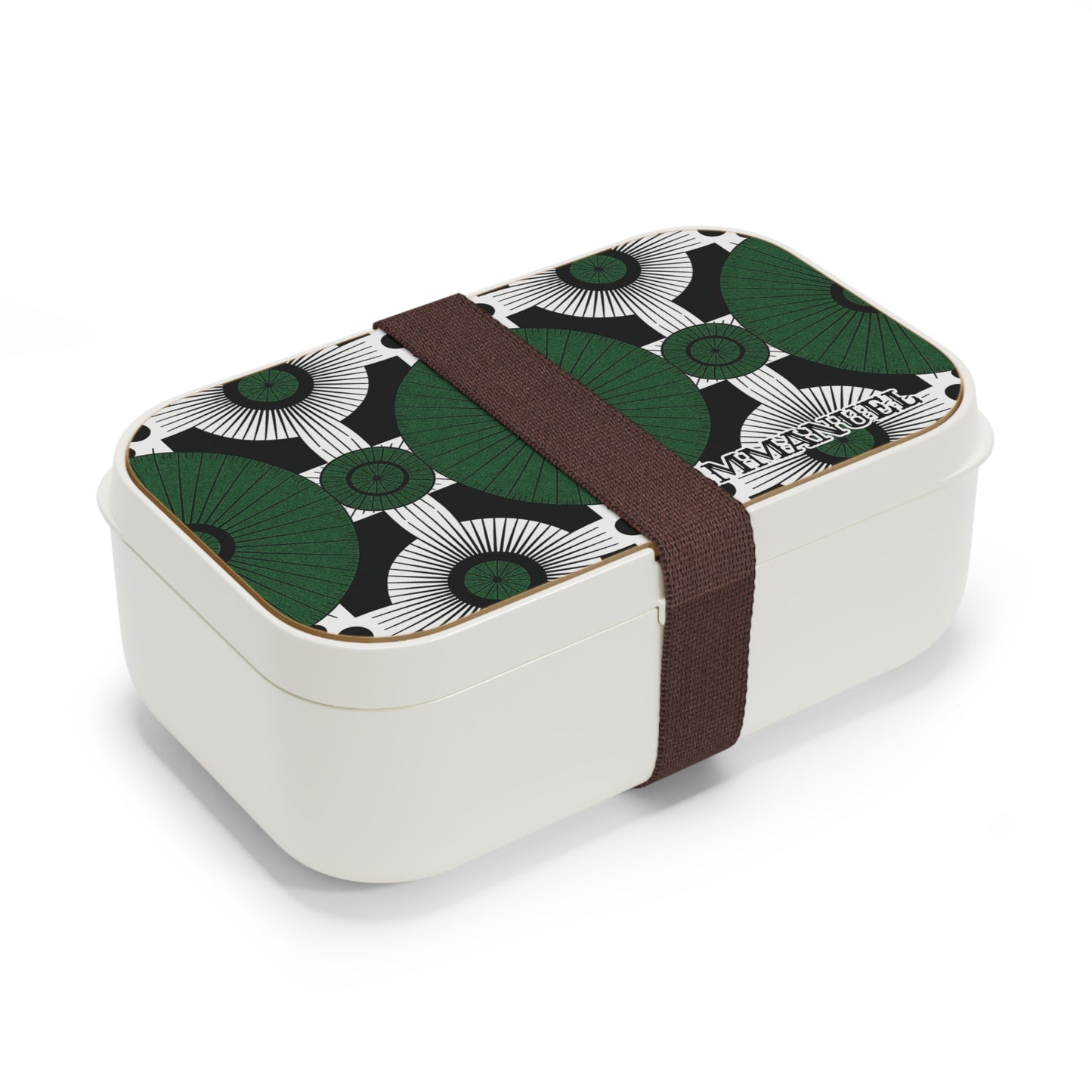 A rectangular white, BPA-free lunchbox with a lid featuring a geometric green, black, and white pattern. A wide, dark brown elastic band secures the box, holding the lid in place. The brand name “MONBENTO” is embossed on one corner of the lid.