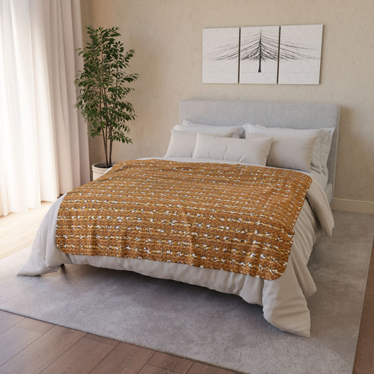 A cozy bedroom with a light gray upholstered bed, layered white and gray pillows, a sherpa fleece blanket in rust tones, a plush gray rug, potted plant in the corner, sheer white curtains, and minimalist wall art featuring a black tree.