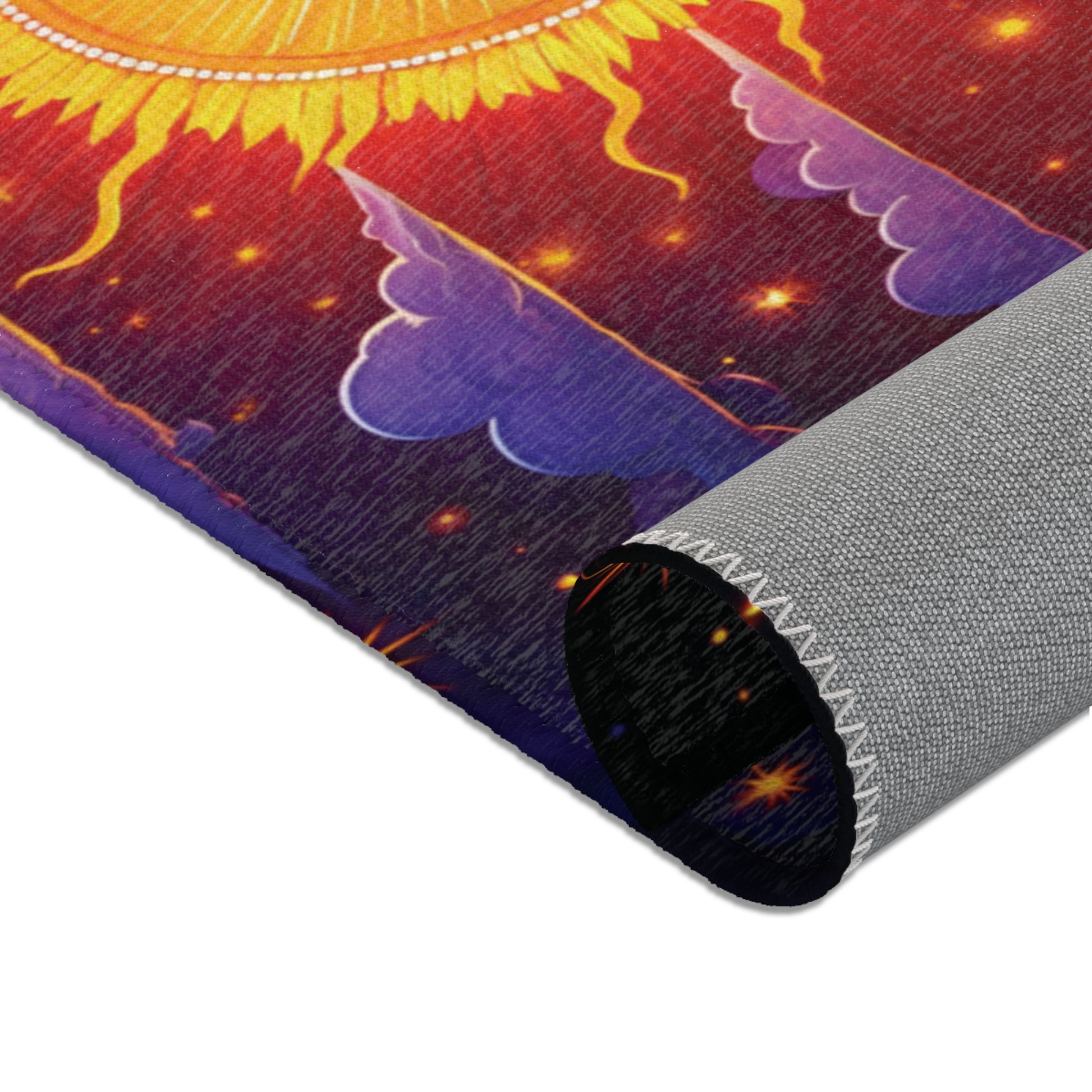 A close-up of a rolled tapestry featuring a vibrant sun with yellow rays, orange and red background, and purple clouds. The gray-edged fabric showcases visible stitching and a celestial theme, perfect for colorful home decor or pairing with African design rugs.