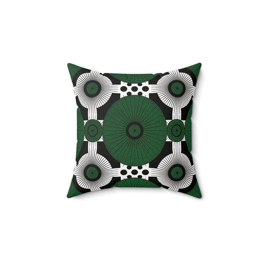 A square faux suede pillow with a bold geometric pattern featuring large green circles, white radiating lines, and small black dots. This green and black throw pillow adds a modern, eye-catching touch to any space. The pillow is centered on a white background.