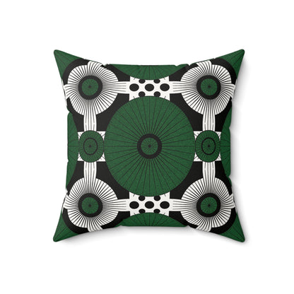 This African inspired accent pillow features a bold geometric pattern with large green ovals, radiating lines, and black polka dots. The white and black background enhances its modern symmetry—perfect as a faux suede pillow for any contemporary space.