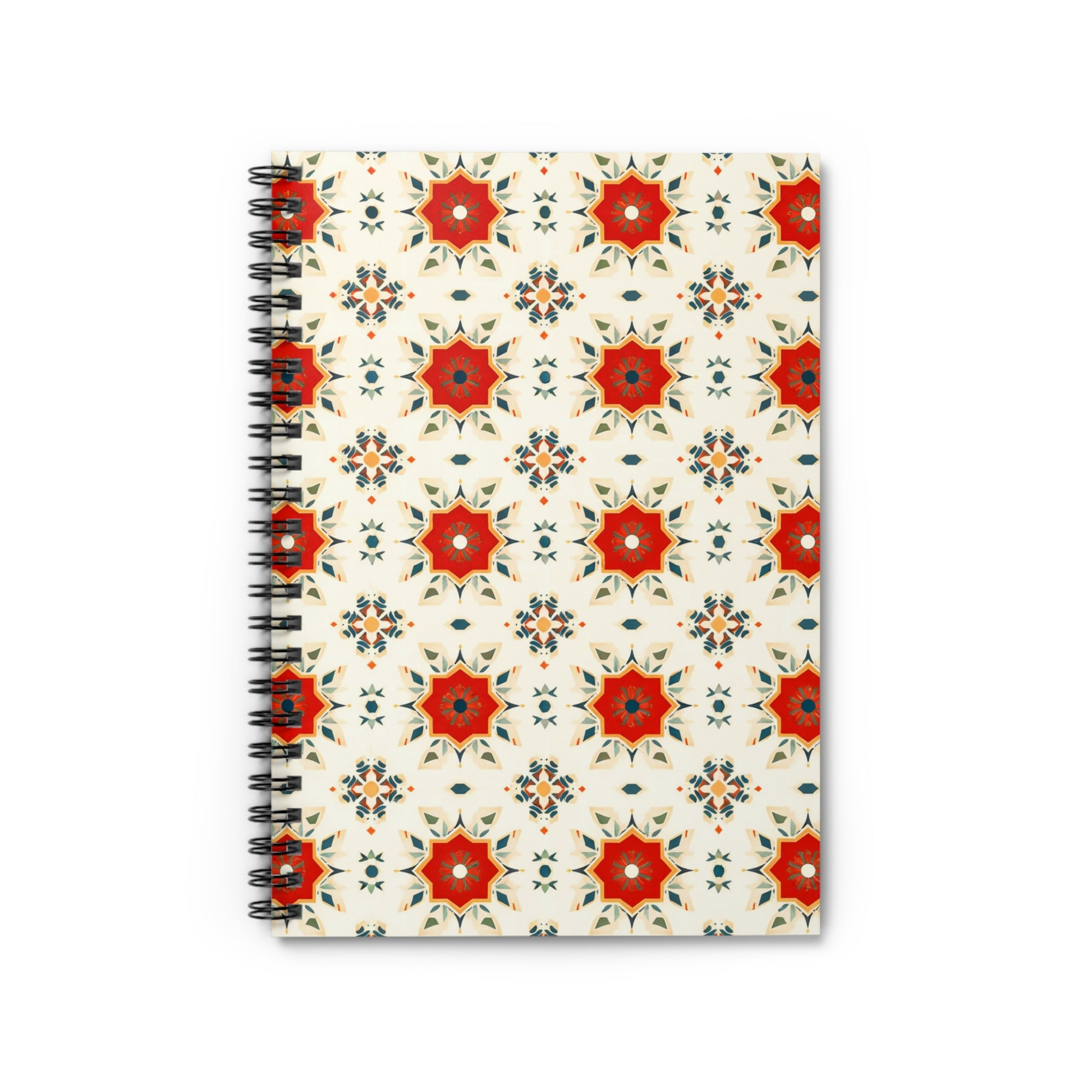 A spiral-bound African-inspired spiral notebook with a glossy cover featuring red, orange, and green geometric star shapes on a cream background. The culturally inspired design is photographed from above on a white surface.
