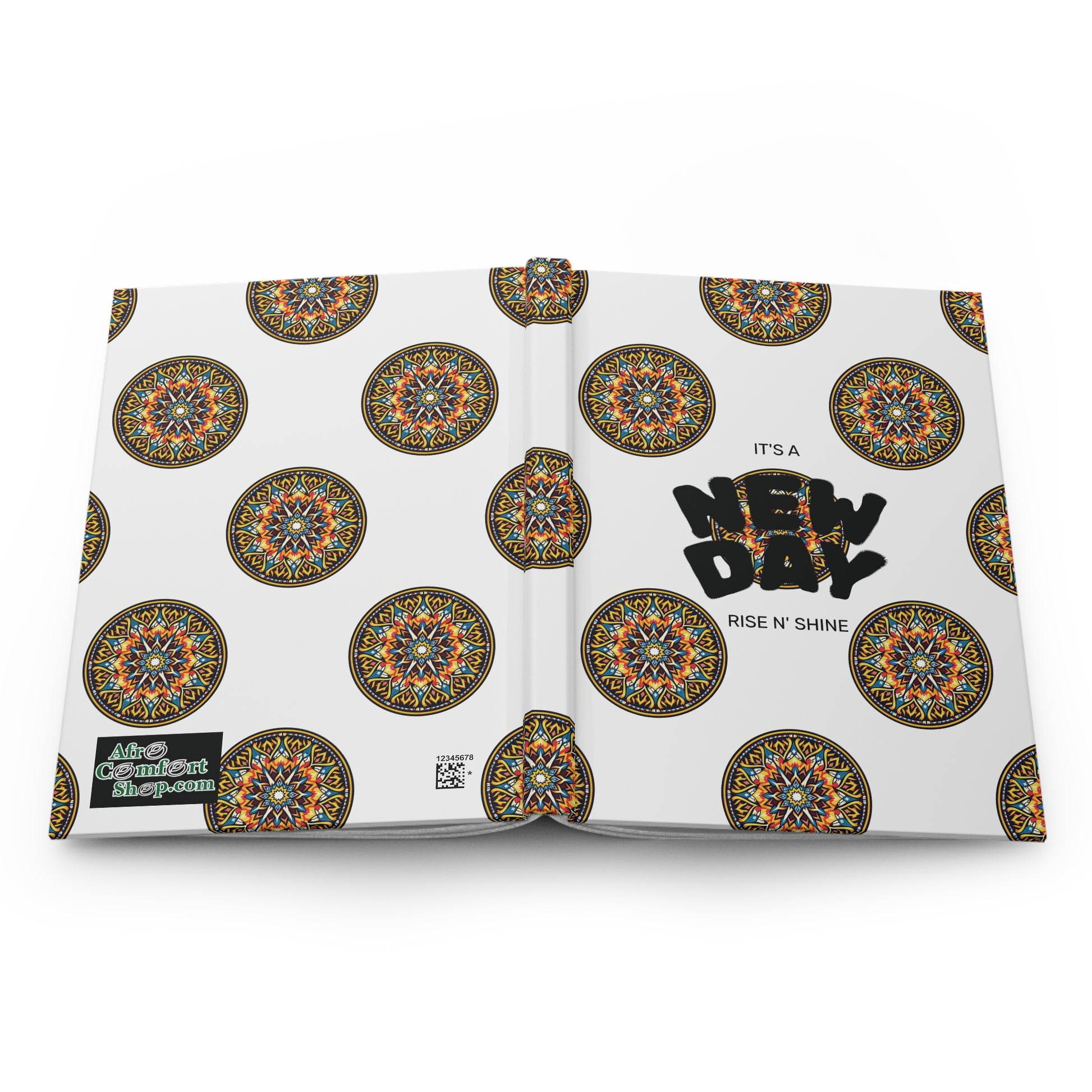 Open book with a white cover featuring colorful, culturally-rich mandala patterns. The African-inspired hardcover journal’s bold text reads, ITS A NEW DAY, RISE N SHINE. A QR code and More Content Inside! appear on the back cover's lower left.