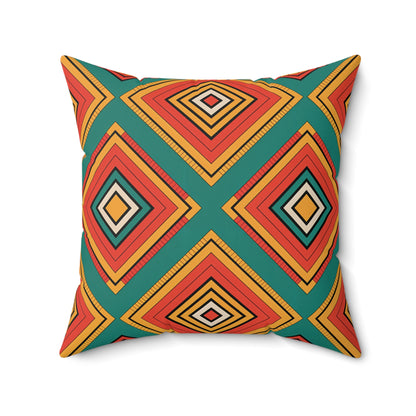 Square faux suede pillow with a bold geometric pattern of diamond shapes in orange, red, yellow, black, and teal. This decorative throw pillow features symmetrical concentric diamonds for a modern, eye-catching African accent against a white background.