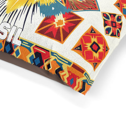 A close-up of a colorful, African-inspired fabric or textile with geometric patterns in red, yellow, blue, and orange. The edge has a fringed finish. Part of the white text SIL is visible on the left, partially cropped out of the frame.