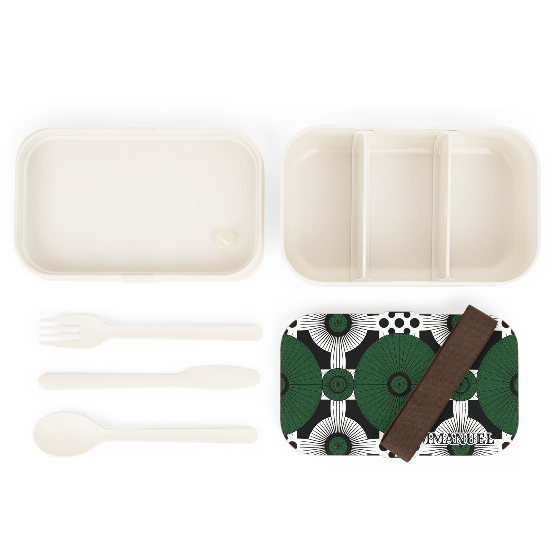 An African-inspired bento lunch box set featuring a white tray with three sections, a matching lid in green and black geometry, a brown elastic band, and BPA-free fork, spoon, and knife—all arranged neatly on a white background.