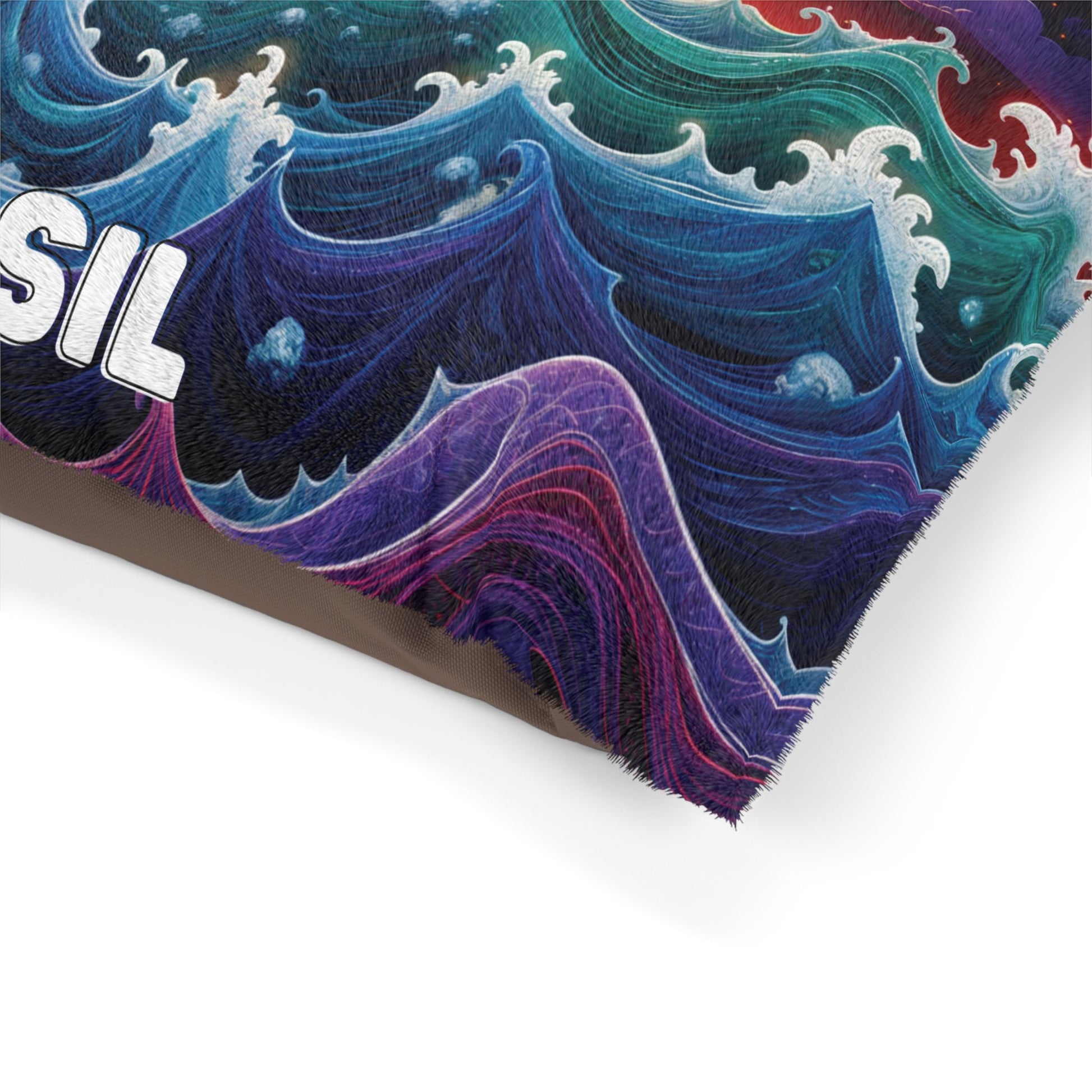 A close-up of a vibrant, swirling wave pattern in blue, green, purple, and red hues with textured, white foam accents. The design features an African-inspired flair. Part of bold white text ending in SIL is visible at the top left; a brown surface edges the bottom.