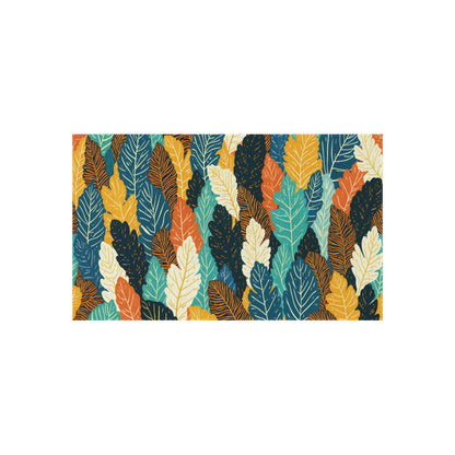 A rectangular pattern of overlapping leaves in orange, yellow, teal, turquoise, cream, and dark blue. Each leaf is outlined with thin, dark lines showing veins, creating a vibrant and colorful African-inspired design on a white background.