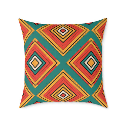 Square African-inspired pillow with a bold geometric pattern of overlapping diamonds in red, orange, yellow, black, and beige on teal. Alternating concentric diamonds and diagonal lines make this a vibrant home decor accent with a modern flair.