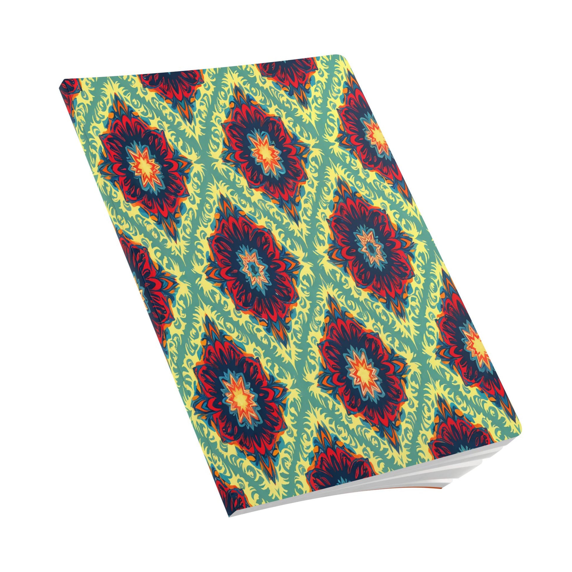 A closed African-inspired journal with a vibrant, geometric pattern in red, yellow, blue, and green. The cover features repeating diamond shapes and floral-like motifs on a light green background. Perfect for daily journaling, it rests at an angle on a white surface.