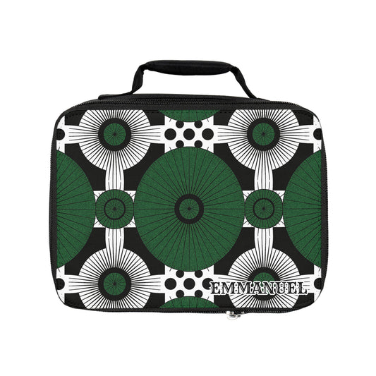 A rectangular insulated lunch tote with a handle, featuring a geometric pattern of large green circles, black and white radiating lines, and polka dots. The name EMMANUEL is printed in bold white letters on the lower right corner.