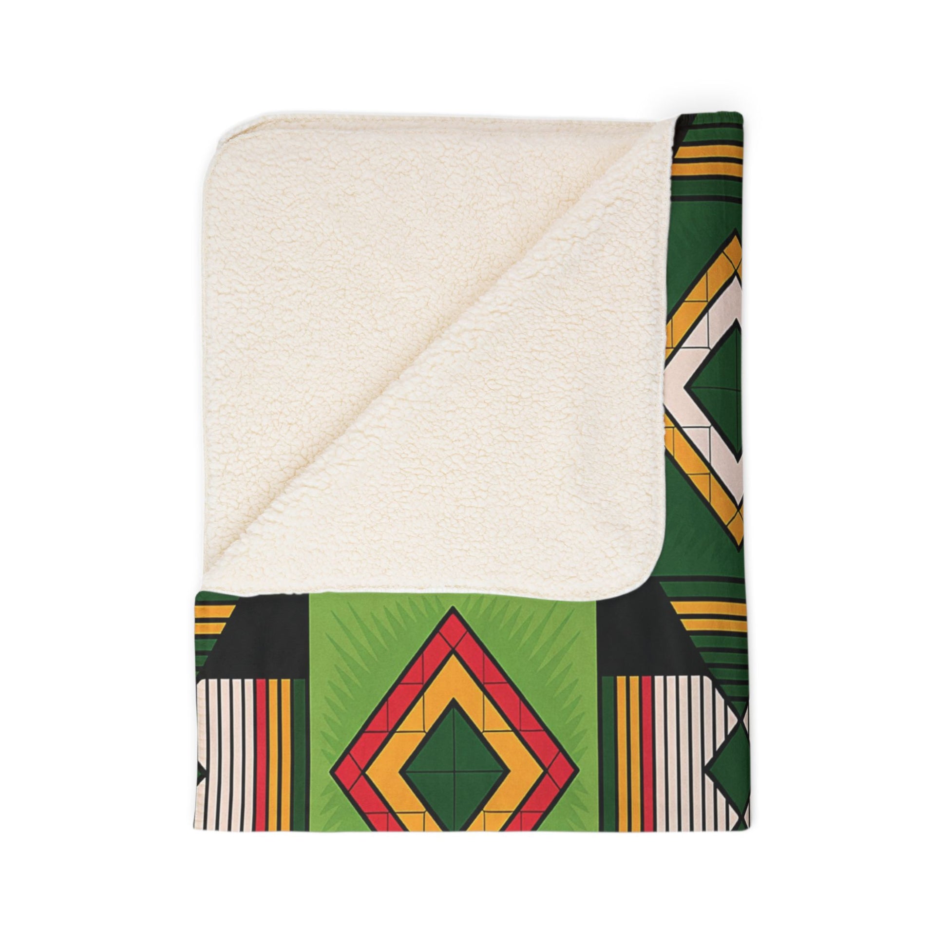 A folded sherpa fleece blanket with a cream, fluffy sherpa lining and an outer side featuring a geometric pattern in green, black, yellow, orange, and red diamond shapes. Perfect for cozy home decor, the corner is flipped to reveal both sides.