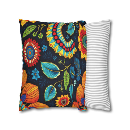 Two square pillows: the front one features vibrant pillowcases with colorful flowers and leaves on a black background, while the back pillow has a simple gray and white horizontal stripe design. Both are set against a plain white backdrop.