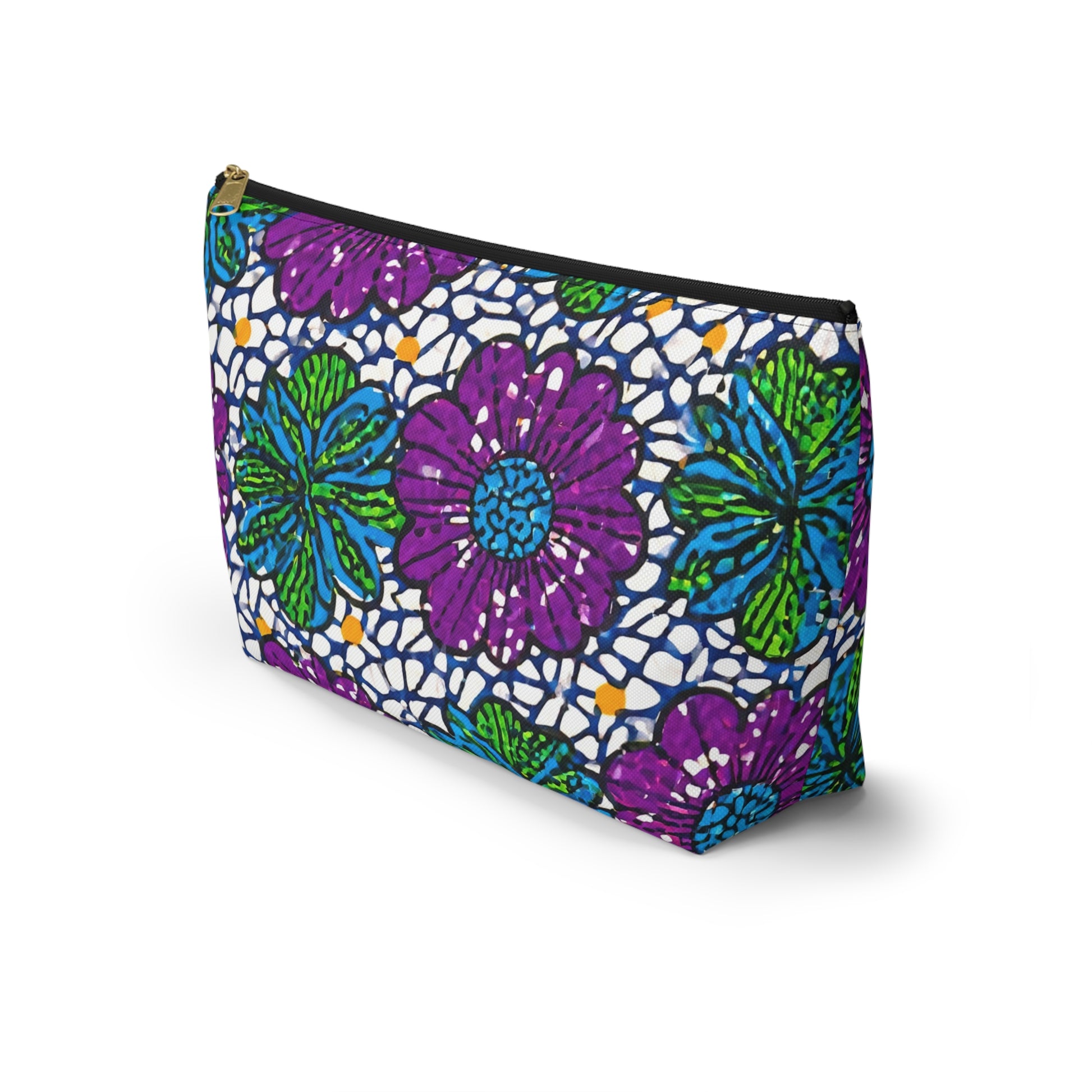 A T-bottom pouch with a zipper, decorated with vibrant, hand-drawn purple and blue flowers, green leaves, and white lace-like African-inspired patterns on a dark background. The cosmetic travel bag stands upright on a white surface.