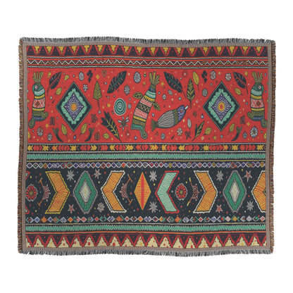 Rectangular woven rug with red and black bands of African-inspired geometric and nature-inspired patterns, including diamonds, arrows, leaves, and stylized animal figures. The colorful designs feature yellows, greens, blues, and whites on a fringed edge.
